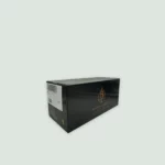 Armand De Brignac Brut Gold Champagne box featuring the iconic gold Ace of Spades emblem, symbolizing elegance and exclusivity.