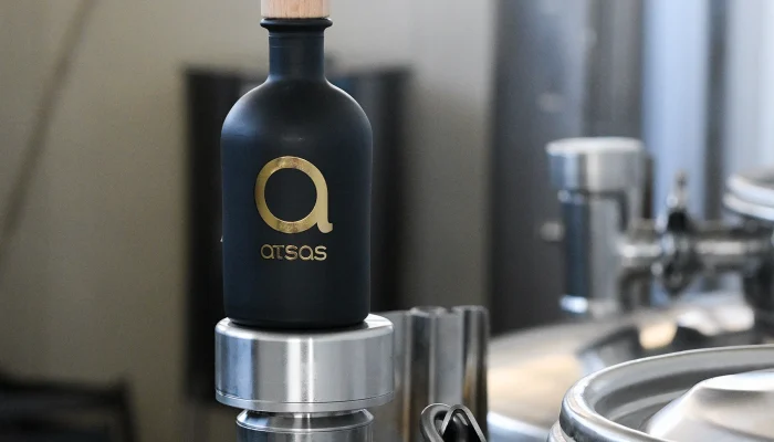 Atsas Olive Oil team showcasing cold extraction techniques to maintain purity and flavor.