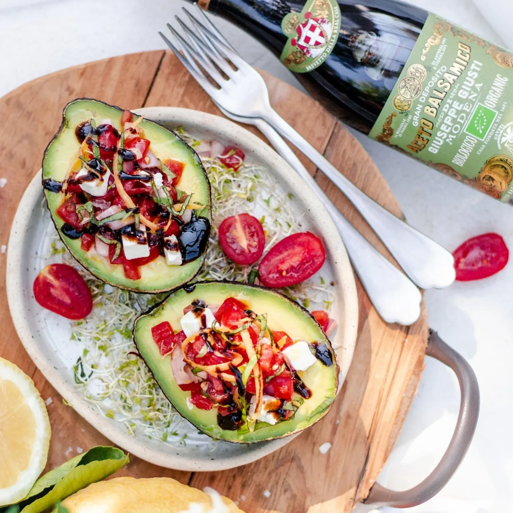 Balsamic Vinegar 3 Gold Medals Organic Champagnotta next to avocado salad