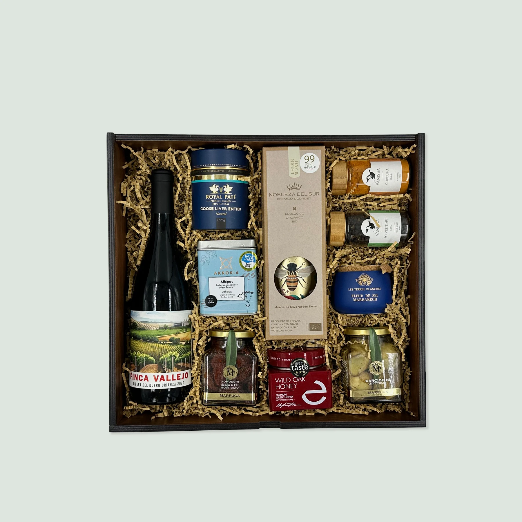 a gift box with luxury gourmet gift box with fine products like Marfuga olive specialties, Nobleza del Sur EVOO, Ribera del Duero wine, and Ikaria herbal tea. Customizable and shipped worldwide via DHL Express