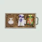 A luxury gift box featuring a bottle of Ladolea extra virgin olive oil, a packet of fresh lavender, and a Lavandia Marjoram container.
