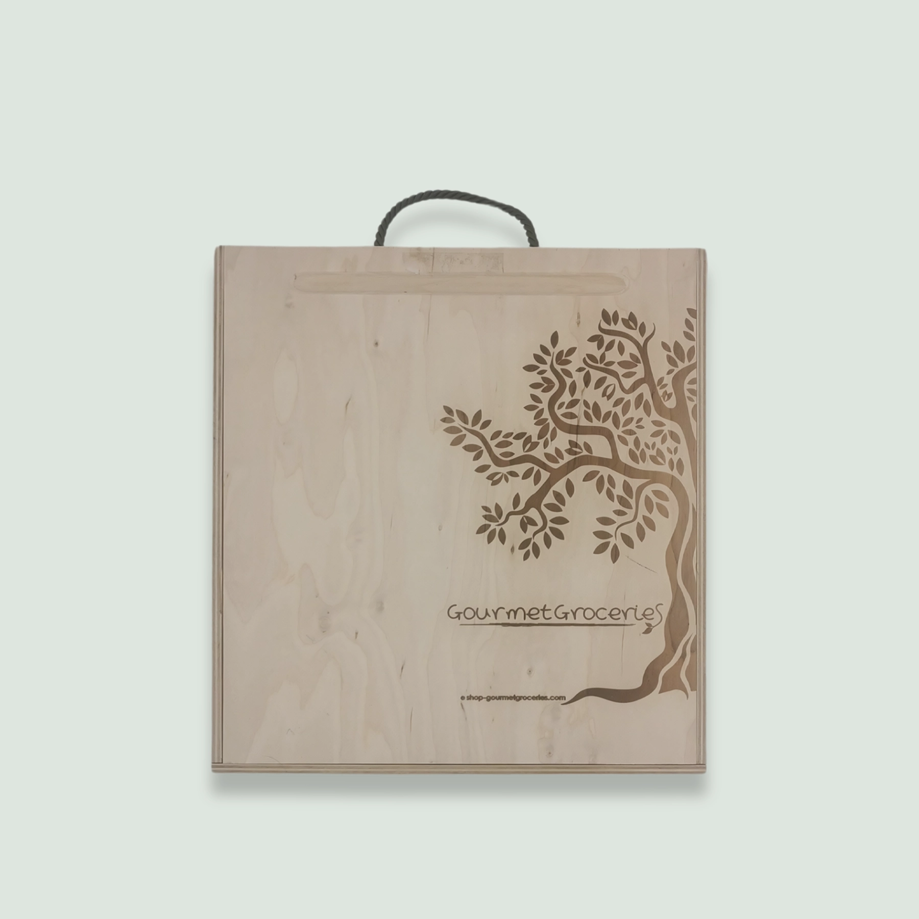 A closed Gourmet Groceries gift box, showing the company logo and website link.