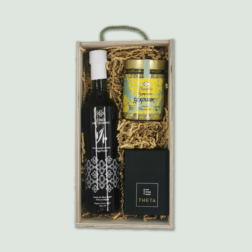 Healthy Box A luxury gift box featuring a bottle of Oro Del Desierto 1/10 Limited Edition, a Lavandia Helichrysum 30 gram container, and a THETA Raw Thyme Honey.