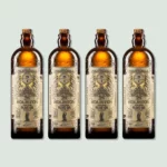 Four bottles of Holiston Best Olive Oil. The bottles are amber-colored with vintage-style labels indicating high polyphenol content, cold extraction, and early harvest. Each bottle has a capacity of 500ml.