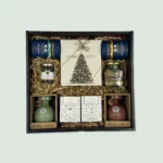 wooden box with mediterranean goodies - chocolates olive oil foies gras and olives as a christmas gift