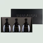 Front view of the Greek Olive Oil Experimental Edition package with three 250ml bottles.