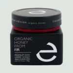 Close-up of the front label of Eulogia’s Premium Organic Fir Honey, showcasing the luxurious 250g jar with elegant branding and details.