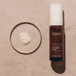 Close-up applying Pro-Aging Serum, showing the texture of the serum on the skin.