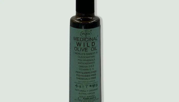 Bottle of Sparta Green Medicinal Olive Oil, showcasing its premium quality and organic certification, with a label emphasizing its natural production methods and health benefits.