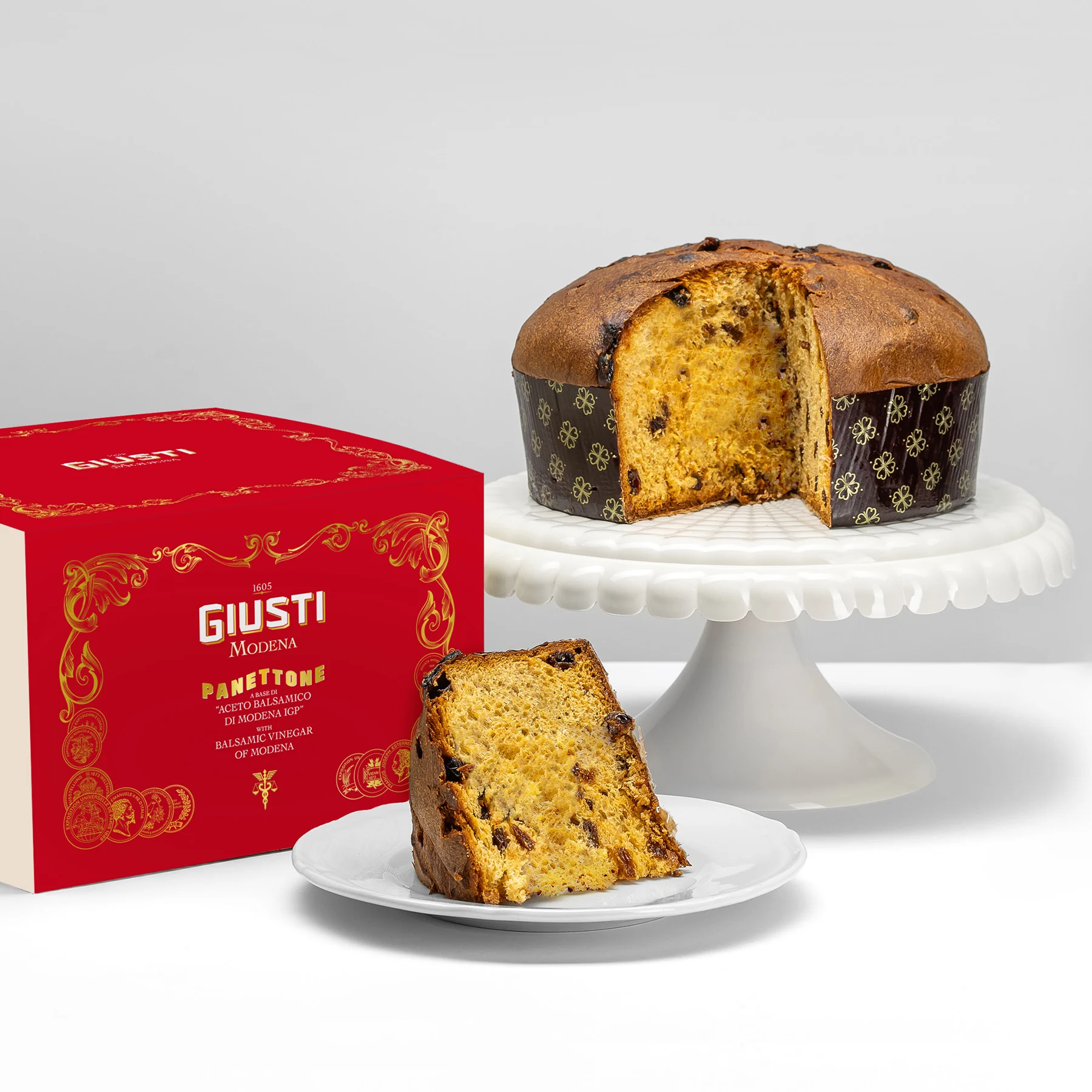 Close-up of panettone slice showing balsamic-infused raisins and soft crumb.